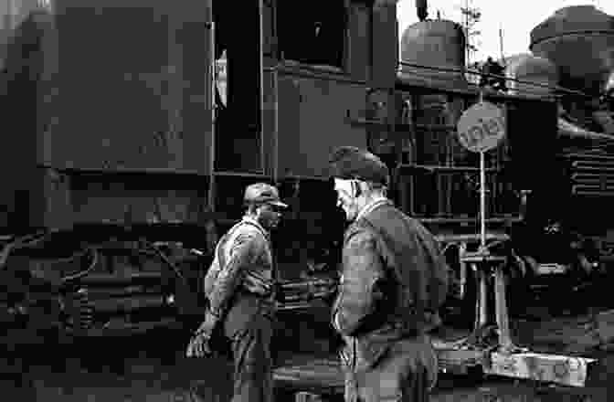 A Black And White Photograph Of A Railroad Worker Standing Next To A Steam Locomotive. Big Bend Railroads (Images Of Rail)