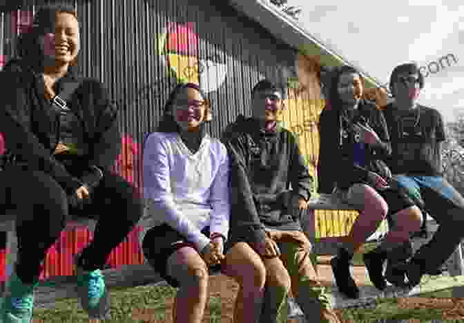 A Group Of Lakota Youth Smiling And Holding Hands Surviving Wounded Knee: The Lakotas And The Politics Of Memory